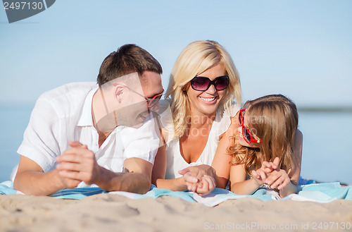 Image of happy family on the beach