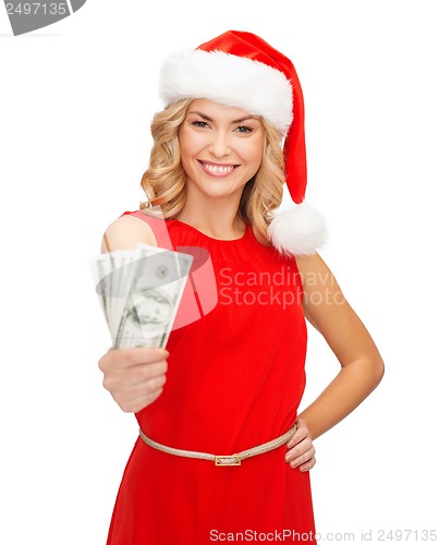 Image of woman in santa helper hat with us dollar money