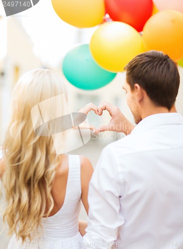 Image of couple with colorful balloons