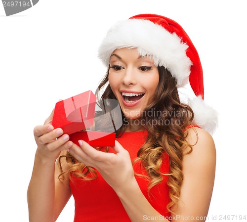 Image of smiling woman in santa helper hat with gift box
