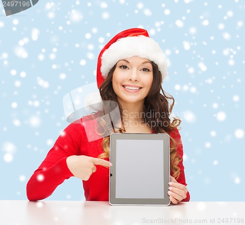 Image of woman in santa helper hat with tablet pc