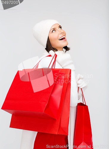 Image of picture of happy woman with shopping bags
