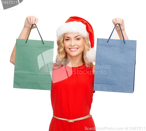 Image of woman in red dress with shopping bags