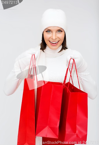 Image of picture of happy woman with shopping bags