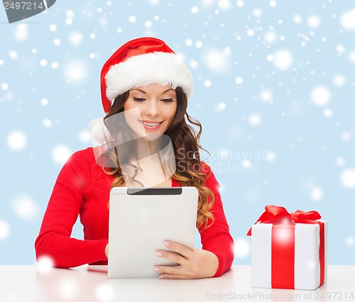 Image of woman with gift box and tablet pc computer