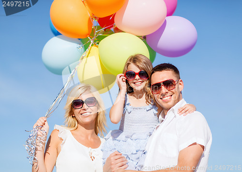 Image of family with colorful balloons