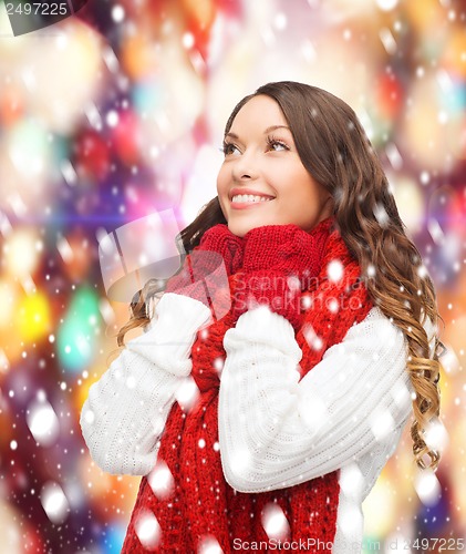 Image of woman in sweater, scarf and mittens