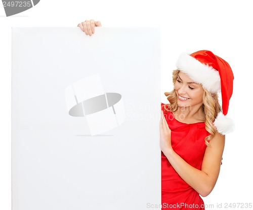 Image of woman in santa helper hat with blank white board