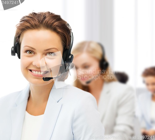 Image of female helpline operator with headphones