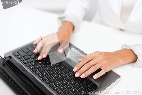 Image of businesswoman using her laptop computer