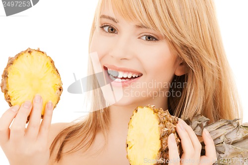 Image of happy girl with pineapple