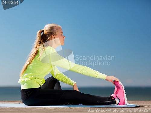 Image of woman doing sports outdoors