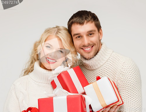 Image of smiling woman and man with gift box