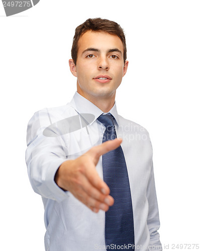 Image of friendly buisnessman with hand ready for handshake