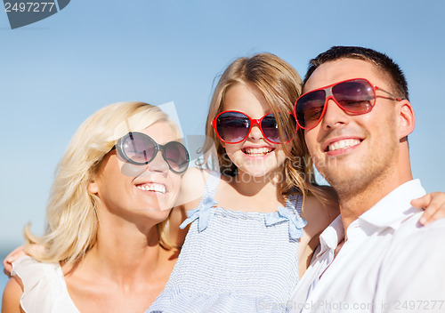 Image of happy family with blue sky