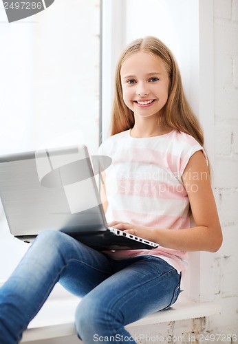 Image of girl with laptop pc at school