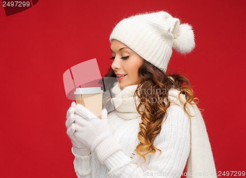 Image of woman in hat with takeaway tea or coffee cup