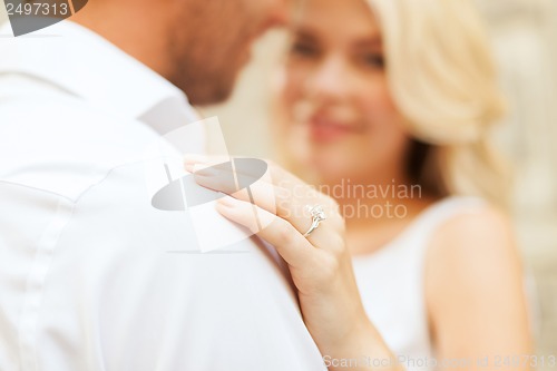 Image of romantic man proposing to beautiful woman