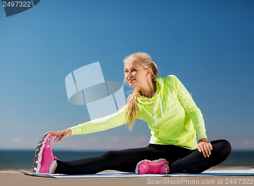 Image of woman doing sports outdoors