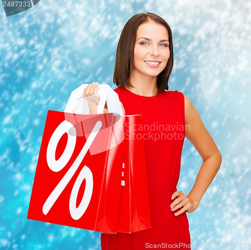 Image of woman in red dress with shopping bags