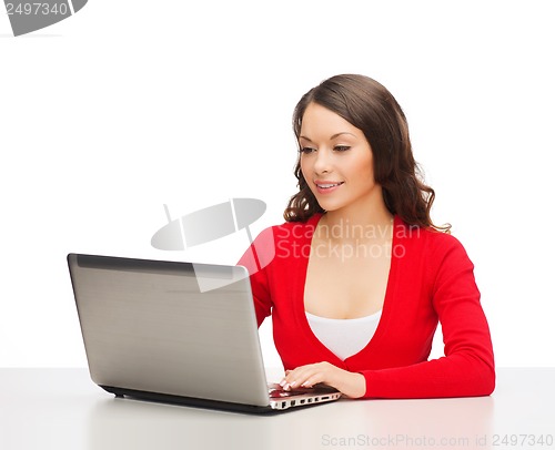 Image of smiling woman in red clothes with laptop computer