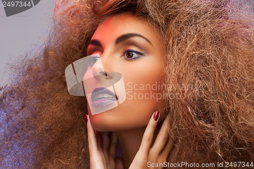 Image of woman with long curly hair