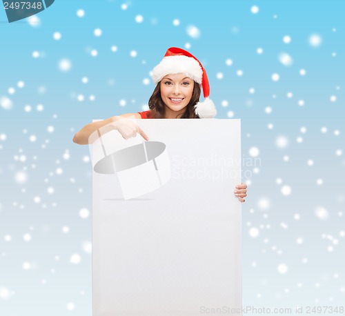 Image of woman in santa helper hat with blank white board