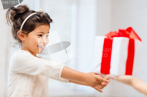 Image of happy child girl with gift box