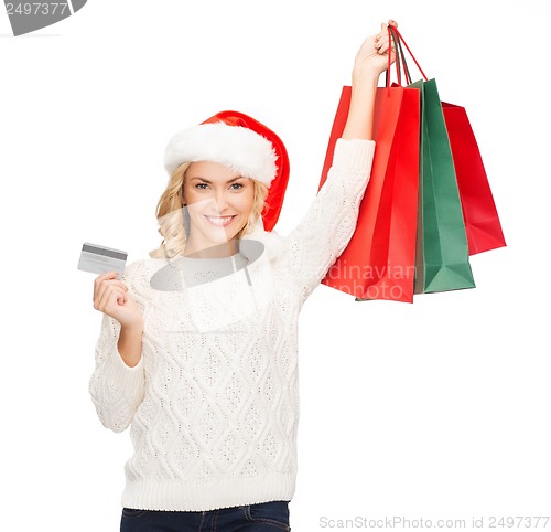 Image of woman with shopping bags and credit card