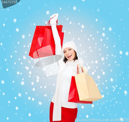 Image of picture of happy woman with shopping bags