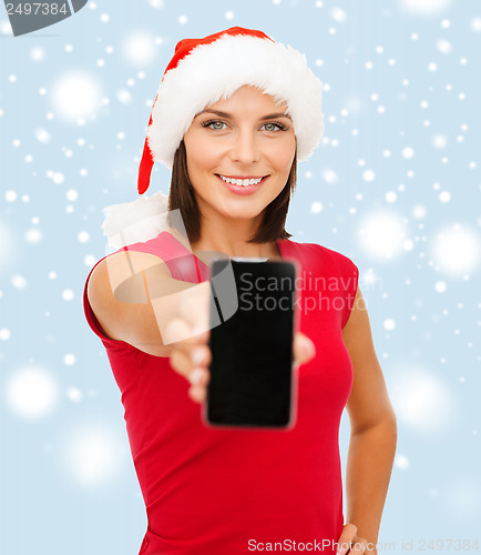 Image of woman in santa helper hat with smartphone