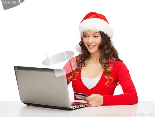 Image of santa helper woman with laptop and credit card