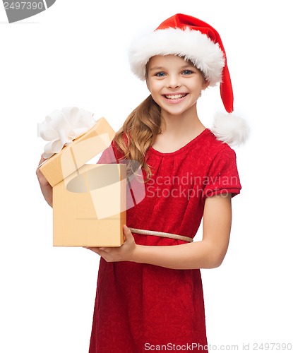 Image of smiling girl in santa helper hat with gift box