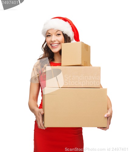 Image of smiling woman in santa helper hat with parcels