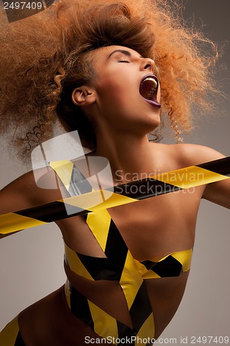 Image of woman with long curly hair