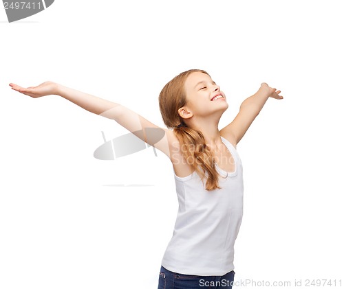 Image of smiling teenage girl with raised hands