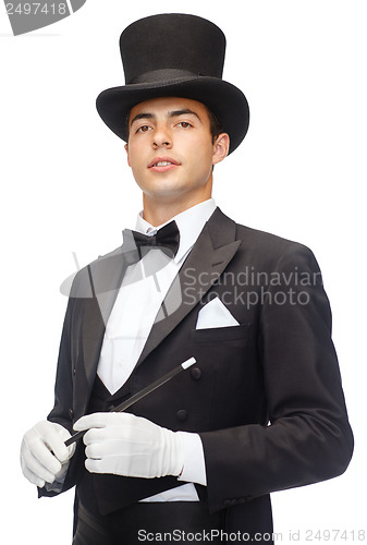 Image of magician in top hat with magic wand showing trick