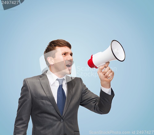 Image of buisnessman with bullhorn or megaphone