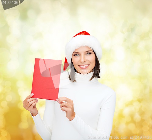 Image of woman in santa helper hat with blank red card