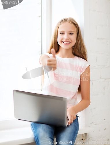 Image of girl with laptop pc at school