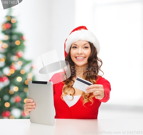 Image of woman with gift, tablet pc and credit card