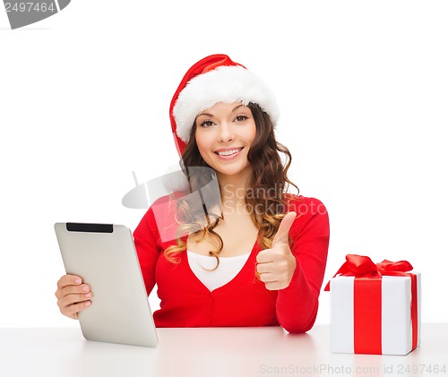 Image of woman with gift box and tablet pc computer