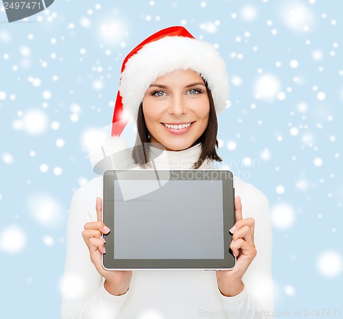 Image of woman in santa helper hat with tablet pc