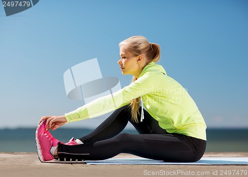Image of woman doing sports outdoors