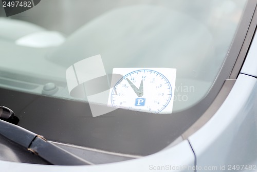 Image of parking clock on car dashboard