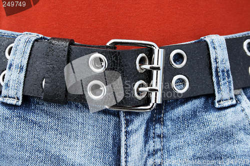 Image of Black leather belt and blue jeans