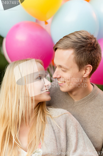 Image of couple with colorful balloons