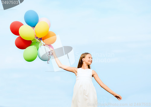 Image of happy girl with colorful balloons