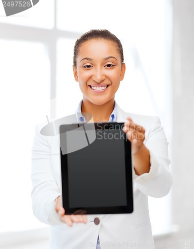 Image of businesswoman with tablet pc in office