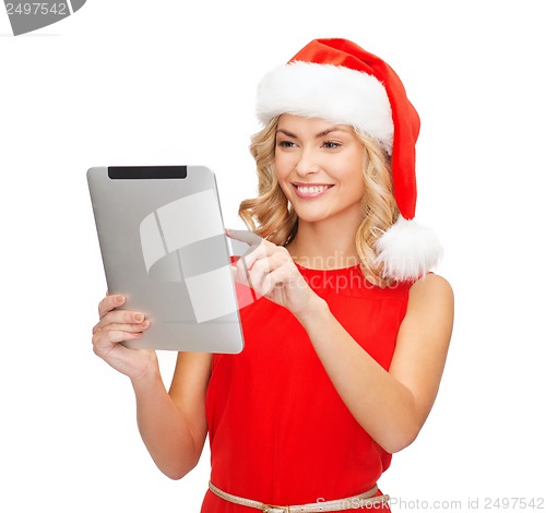 Image of woman in santa helper hat with tablet pc